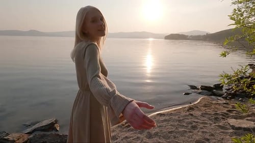 Follow Me Pov of Pretty Woman Leads Boyfriend By Hand in Sea Looking at Camera