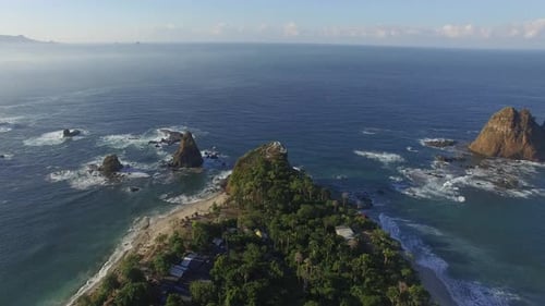 Tropical Peninsula with Rugged Coastline Aerial View