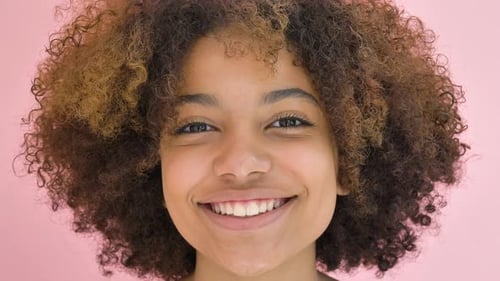 Smiling Woman with Curly Hair Close Up