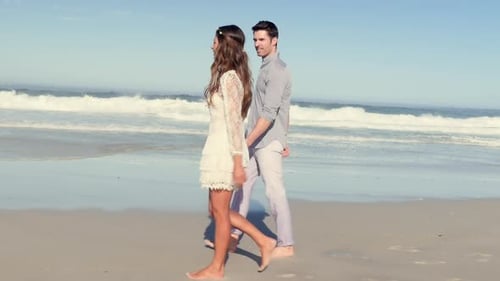 Couple walking on beach