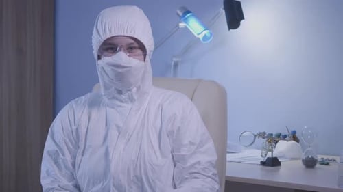 Scientist in Hazmat Suit Gives Thumbs Up