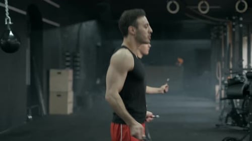 Athletes Jumps on Skipping Rope. In Sports Hall or Gym. 50Fps Footage
