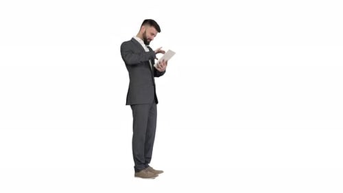 Businessman Standing and Using Tablet Computer on White Background