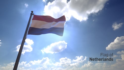 Dutch Flag Waving on Pole Against Sunny Blue Sky