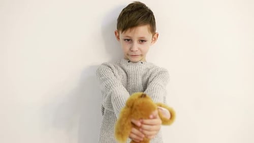 Boy Holds Stuffed Bunny Toy