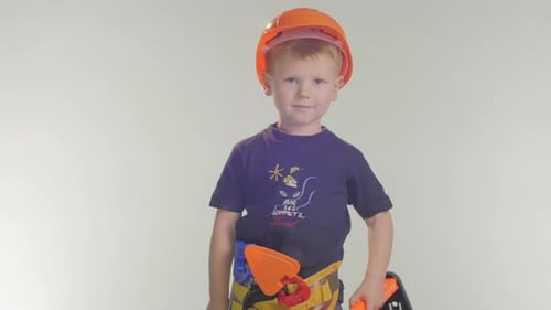 Happy Boy in Construction Hat Smiles