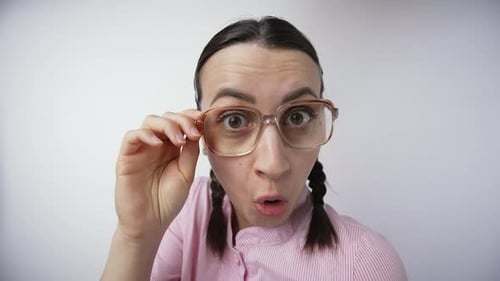 Woman with Glasses Making Surprised Expressions