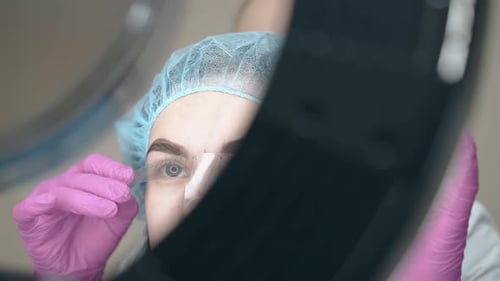 Woman Receiving Eyebrow Measurement in Beauty Clinic