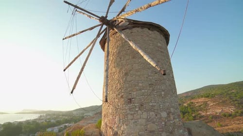 Ancient Stone Windmill Against a Tropical Sky