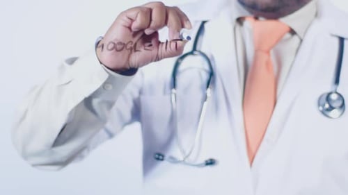 Medical Professional Writing 'Google It!' on Clear Surface