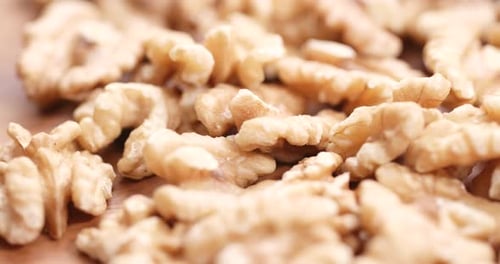 Peeled Walnuts Close-up on Wooden Surface