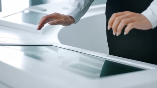 Closeup of Hands Touching Modern Screen in the Hitech Office or Software Lab