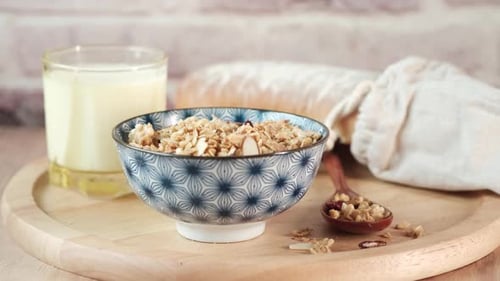 Granola Bowl with Milk and Bread for Breakfast