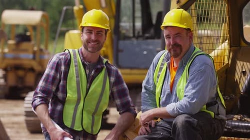 Portrait of two blue collar workers