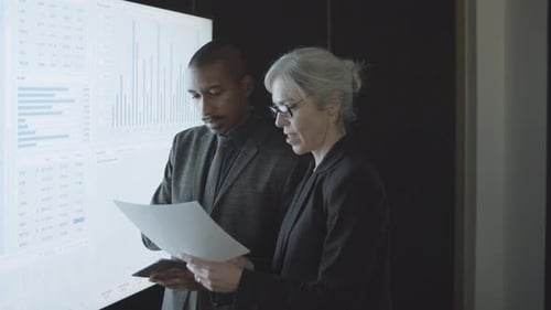 Professional Investors Analyzing Stock Market Statistics