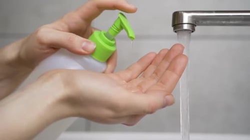 Close Up Of Woman Washing Hands With Soap