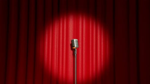 A vintage microphone on the stage. Old classic mic in the theatre. Show.Closeup