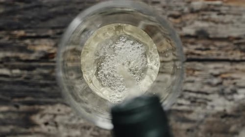 White Wine Being Poured Into Glass