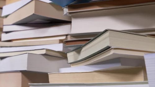 Pile of Books Stacked in Disarray