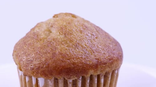 Muffins banana with white background shallow focus and slowly rotating.