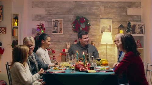 Family Together at Christmas Dinner Taking Photos