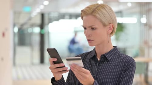Woman With Credit Card Has Trouble On Phone