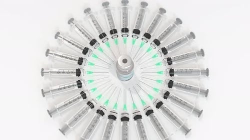 Rotating Syringes Reveal Medical Vaccine Vial Animation