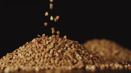 Buckwheat Grains Pouring onto Pile