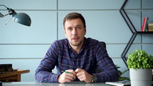 Young Adult Explaining Business Concepts in Office