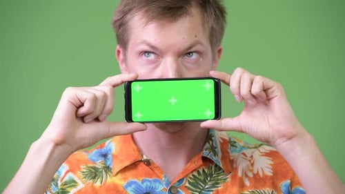 Young Man Holds Chroma Key Smartphone