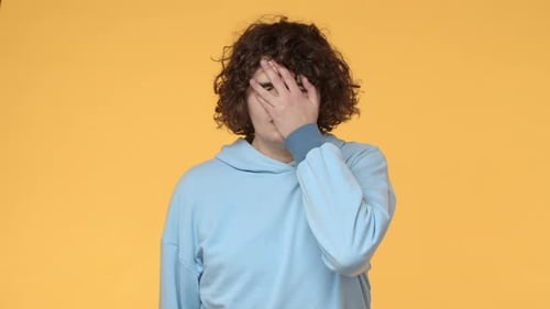 Slowmotion Annoyed and Fed Up Young Curly Guy Listen Friend Lame Story Dumb Mistake Punch Himself at