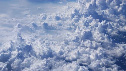 Majestic White Clouds Fill Bright Blue Sky