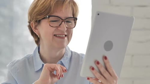 Woman with Short Hair Holding Tablet, Video Calling