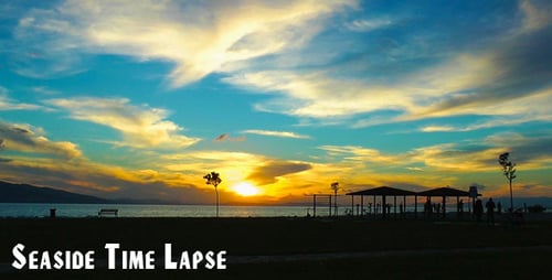 Peaceful Beach Sunset with Silhouettes of People