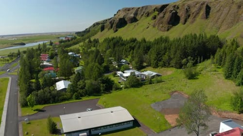 Drone View of Little Village in Green Meadow of Iceland Countryside