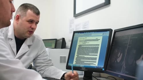 Two Doctors are Discussing an MRI Picture of a Patient
