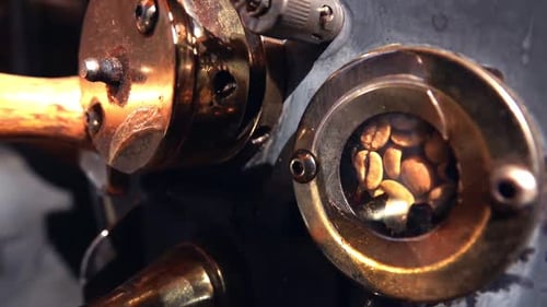 Close Up of Rotating Coffee Beans in Roasting Machine