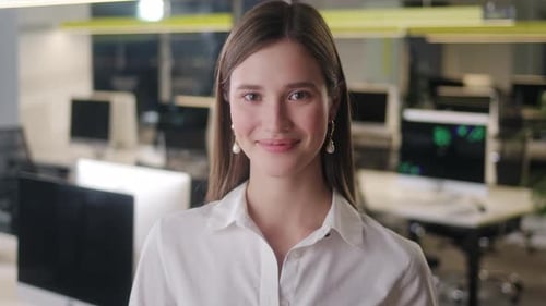 Smiling Young Woman Working in Modern Office