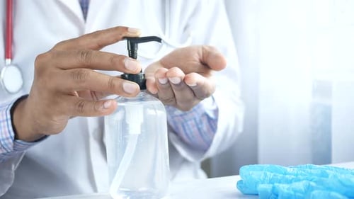 Close Up of Doctor Hand Using Sanitizer Gel