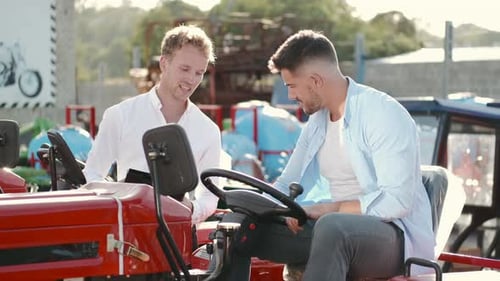 Attractive Man Buying a Tractor at Outdoor Shop