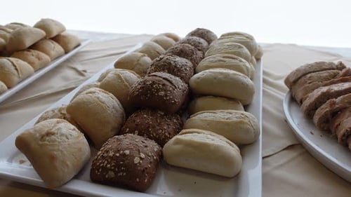 Assorted Breads on White Serving Trays