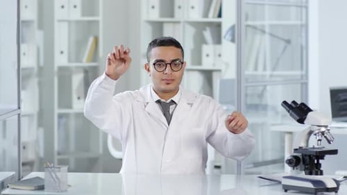 Male Scientist Working with Invisible Virtual Technology