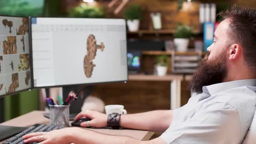 Portrait of Bearded 3D Designer Working on Gear Prototypes