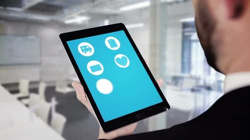 Man Using Medical App on Tablet in Office