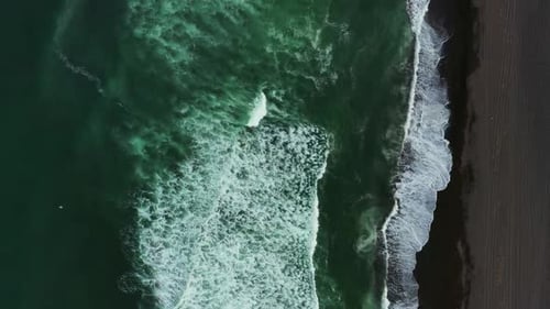 Aerial Top View of Beach with Black Sand