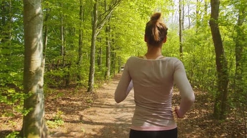 Rear View of Woman Jogging