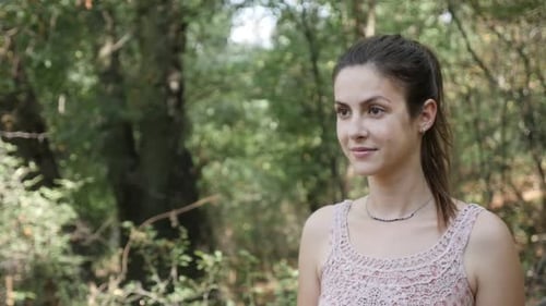 Beautiful Caucasian girl in the forest slow-mo footage