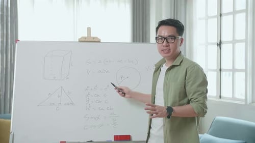 Adult Explaining Math Concepts at Whiteboard