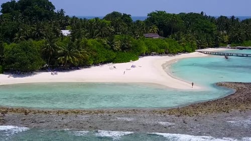 Aerial drone travel of tourist beach trip by blue ocean with sand background