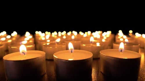 Candles Flickering Warmly in the Darkness